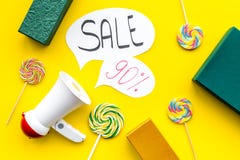 Sale concept with megaphone. Declare the sale. Electronic megaphone near word sale in cloud, gift boxes and sweets on Royalty Free Stock Photo Sale concept with megaphone. Declare the sale. Electronic megaphone near word sale in cloud, gift boxes and sweets on Royalty Free Stock Photo