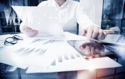 Sales Management Work Time Process.Photo Trader working Market Report Documents Touching Screen Tablet.Using Graphics stock image Sales Management Work Time Process.Photo Trader working Market Report Documents Touching Screen Tablet.Using Graphics stock image