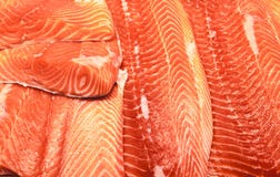 Salmon fillets. Fresh fillet of salmon, trout, on the market on ice. Stock Photography Salmon fillets. Fresh fillet of salmon, trout, on the market on ice. Stock Photography