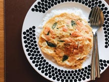 Salmon omelette with rice in a large dish stock photos Salmon omelette with rice in a large dish stock photos