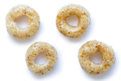 Samling av fyra honungcheerios som isoleras på vit fotografering för bildbyråer Samling av fyra honungcheerios som isoleras på vit fotografering för bildbyråer