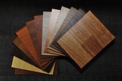 Samples of laminate and vinyl floor tile on wooden Background.wood texture floor stock images Samples of laminate and vinyl floor tile on wooden Background.wood texture floor stock images