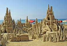 Sand castle on the beach. Sand castle on the sunny beach Sand castle on the beach. Sand castle on the sunny beach