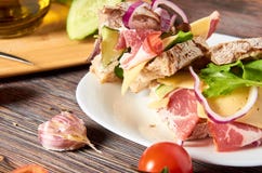 Sandwich with bacon, cheese, garlic, jalapeno pepper and herbs on a plate royalty free stock photos Sandwich with bacon, cheese, garlic, jalapeno pepper and herbs on a plate royalty free stock photos