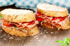 Sandwich with salami sausage on wooden background close up. royalty free stock photos Sandwich with salami sausage on wooden background close up. royalty free stock photos