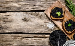 Sandwiches With Black Caviar, A Jar Of Caviar And Spoon. Royalty Free Stock Photos Sandwiches With Black Caviar, A Jar Of Caviar And Spoon. Royalty Free Stock Photos
