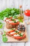 Sandwiches With Mozzarella, Tomatoes And Rye Bread Royalty Free Stock Photography