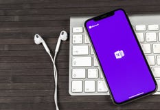 Microsoft OneNote office application icon on Apple iPhone X screen close-up. Microsoft One Note app icon. Microsoft OneNote applic royalty free stock images Microsoft OneNote office application icon on Apple iPhone X screen close-up. Microsoft One Note app icon. Microsoft OneNote applic royalty free stock images