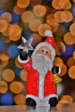 Santa che tiene la stella polare fotografie stock Santa che tiene la stella polare fotografie stock