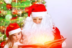 Santa Claus with cute granddaughter Stock Photography Santa Claus with cute granddaughter Stock Photography