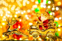Santa Claus with gifts on car with christmas deer, on bokeh backg stock photography Santa Claus with gifts on car with christmas deer, on bokeh backg stock photography