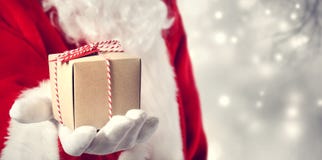 Santa Claus Giving A Gift Santa Claus Giving A Gift