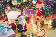Santa claus hold bell, white and violet christmas candle, Ornament decorate Merry Christmas and happy new year stock photo Santa claus hold bell, white and violet christmas candle, Ornament decorate Merry Christmas and happy new year stock photo