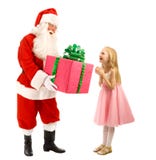 Santa Gives en gåva till en lycklig liten flicka arkivfoto Santa Gives en gåva till en lycklig liten flicka arkivfoto