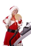 Santa Helper With Big Cookie And Milk On Treadmill Stock Photo Santa Helper With Big Cookie And Milk On Treadmill Stock Photo