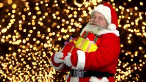 Santa with presents. Santa Claus thumb up gesture Santa with presents. Santa Claus thumb up gesture
