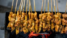 Satay or sate is an Indonesian and Malaysian dish consisting of small pieces of meat royalty free stock images Satay or sate is an Indonesian and Malaysian dish consisting of small pieces of meat royalty free stock images