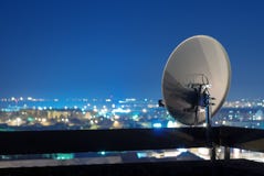 Satellite dish antenna on top of the building at night. royalty free stock photo Satellite dish antenna on top of the building at night. royalty free stock photo