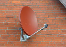 Satellite dish on a brick wall Stock Photography Satellite dish on a brick wall Stock Photography