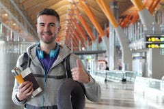 Satisfied traveler giving a thumbs up from the airport royalty free stock photo Satisfied traveler giving a thumbs up from the airport royalty free stock photo