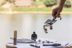 Saving money concept, Male hand putting money coin stack growing royalty free stock image Saving money concept, Male hand putting money coin stack growing royalty free stock image