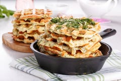 Savory vegetable waffles with cheese and herbs stock photography Savory vegetable waffles with cheese and herbs stock photography