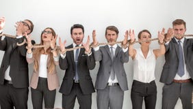Scared group of business people tied with a rope. royalty free stock image Scared group of business people tied with a rope. royalty free stock image
