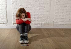 Scared pregnant teenager girl or young desperate woman looking to positive pregnancy test royalty free stock image Scared pregnant teenager girl or young desperate woman looking to positive pregnancy test royalty free stock image