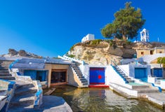 Scenic Mandrakia village traditional Greek village by the sea, the Cycladic-style with sirmata - traditional fishermen`s houses. royalty free stock photos Scenic Mandrakia village traditional Greek village by the sea, the Cycladic-style with sirmata - traditional fishermen`s houses. royalty free stock photos