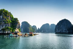 Scenic view of floating fishing village in the Ha Long Bay stock photos Scenic view of floating fishing village in the Ha Long Bay stock photos