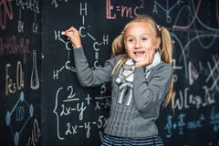 School board, math formula, schoolgirl with very surprised face stock photography School board, math formula, schoolgirl with very surprised face stock photography