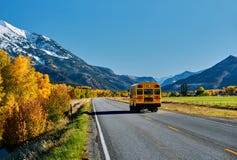 School Bus On Highway In Colorado At Autumn Stock Image