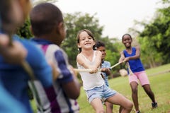School Children Playing Tug Of War With Rope Stock Images School Children Playing Tug Of War With Rope Stock Images