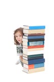 School girl hiding behind books royalty free stock photo School girl hiding behind books royalty free stock photo