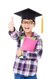 school kid in graduation cap with thumb up Stock Photography school kid in graduation cap with thumb up Stock Photography