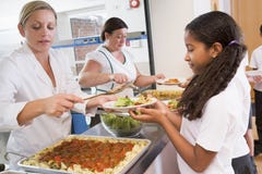 Schoolgirl in a school cafeteria Royalty Free Stock Photography Schoolgirl in a school cafeteria Royalty Free Stock Photography