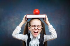 Schoolgirl Wear Glasses Carry Book Apple on Head royalty free stock photography Schoolgirl Wear Glasses Carry Book Apple on Head royalty free stock photography