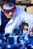 Scientist doing research in a quantum optics lab Royalty Free Stock Photography Scientist doing research in a quantum optics lab Royalty Free Stock Photography