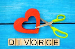 Scissors cut heart. the inscription `divorce`. the concept of breaking relations, quarrels. treachery, betrayal. cancellation of m Royalty Free Stock Photography Scissors cut heart. the inscription `divorce`. the concept of breaking relations, quarrels. treachery, betrayal. cancellation of m Royalty Free Stock Photography