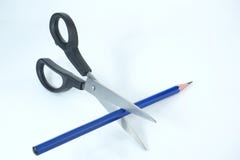 Scissors cutting a blue wooden pencil on white background stock photography Scissors cutting a blue wooden pencil on white background stock photography