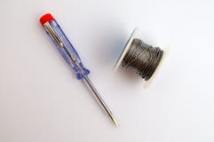 Screwdriver for testing electricity in addition to the coiled tin stock image Screwdriver for testing electricity in addition to the coiled tin stock image