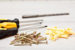 Screwdrivers, drill and screws on white wooden background stock photos Screwdrivers, drill and screws on white wooden background stock photos