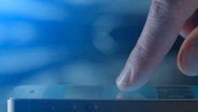Scrolling the images on touchscreen in the blue. Background close-up stock video Scrolling the images on touchscreen in the blue. Background close-up stock video