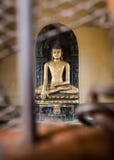 Sculpture of Buddha which is behind bars. royalty free stock image Sculpture of Buddha which is behind bars. royalty free stock image