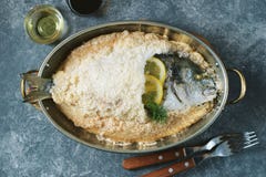 Sea Fish, Dorado Fish Baked In Coarse Salt Mixed With Egg White. Healthy Food. Top View. Stock Images