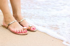 Sea foam, waves and naked feet on a sand beach. Holidays, relax royalty free stock photography Sea foam, waves and naked feet on a sand beach. Holidays, relax royalty free stock photography