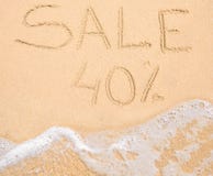 The word Sale 40% written in the sand on beach Stock Photos The word Sale 40% written in the sand on beach Stock Photos