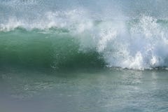 Seafoam green wave with off shore wind spray breaking in the Pacific Ocean Royalty Free Stock Photography Seafoam green wave with off shore wind spray breaking in the Pacific Ocean Royalty Free Stock Photography