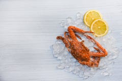 Seafood crab boiled cooked lemon and ice on white wooden background Blue Swimming Crab royalty free stock photo Seafood crab boiled cooked lemon and ice on white wooden background Blue Swimming Crab royalty free stock photo