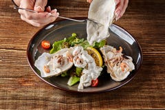 Seafood. Restaurant cuisine, healthy delicatessen food. Oysters, shrimps, octopus in white cream sauce in the shell of royalty free stock image Seafood. Restaurant cuisine, healthy delicatessen food. Oysters, shrimps, octopus in white cream sauce in the shell of royalty free stock image